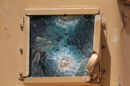 A broken glass window of a military vehicle is seen during a fight with Islamic State militants in western Mosul, Iraq May 18, 2017. REUTERS/Alaa Al-Marjani