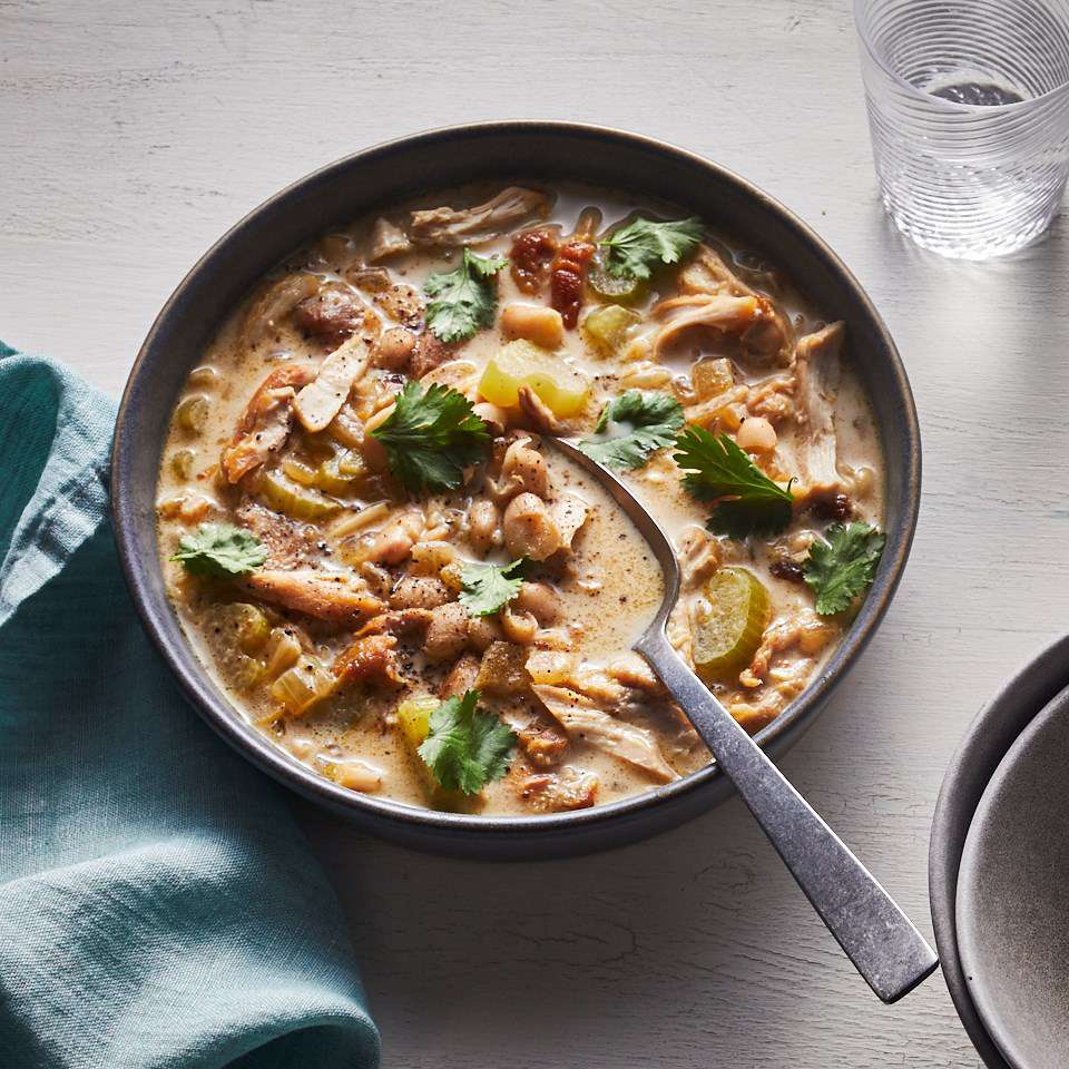 <p>This rich, yet healthy, white chicken chili comes together in a flash thanks to quick-cooking chicken thighs and canned white beans. Mashing some of the beans acts as a fast thickener when your soups don't have a long time to simmer. Cream cheese adds the final bit of richness and a hint of sweet tang. <a href="https://www.eatingwell.com/recipe/269831/creamy-white-chili-with-cream-cheese/" rel="nofollow noopener" target="_blank" data-ylk="slk:View Recipe" class="link ">View Recipe</a></p>