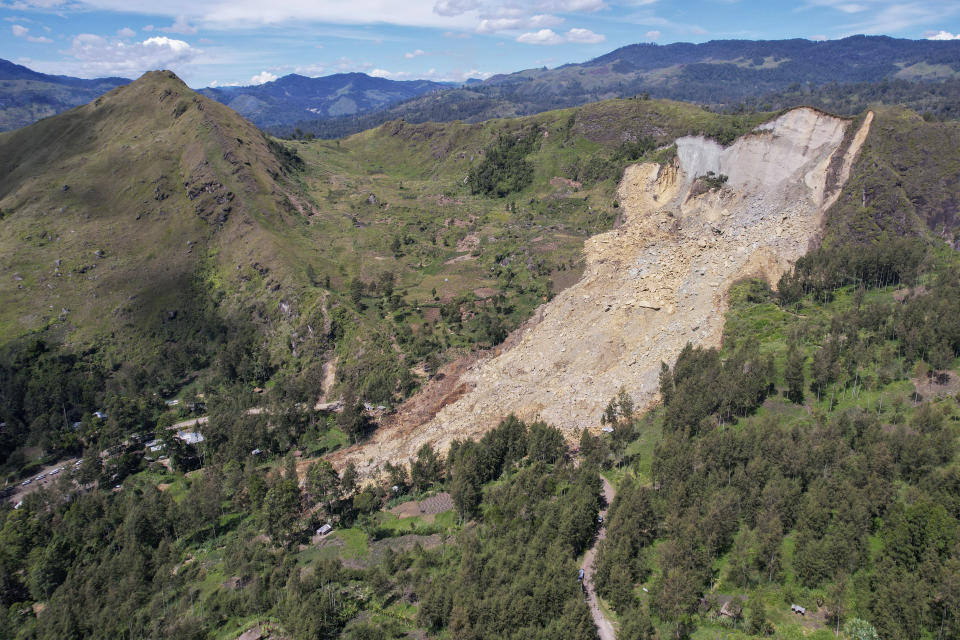 This photo released by UNDP Papua New Guinea, shows a landslide in Yambali village, in the Highlands of Papua New Guinea, Monday, May 27, 2024. Authorities fear a second landslide and a disease outbreak are looming at the scene of Papua New Guinea's recent mass-casualty disaster because of water streams trapped beneath tons of debris and decaying corpses seeping downhill following the May 24 landslide. (Juho Valta/UNDP Papua New Guinea via AP)