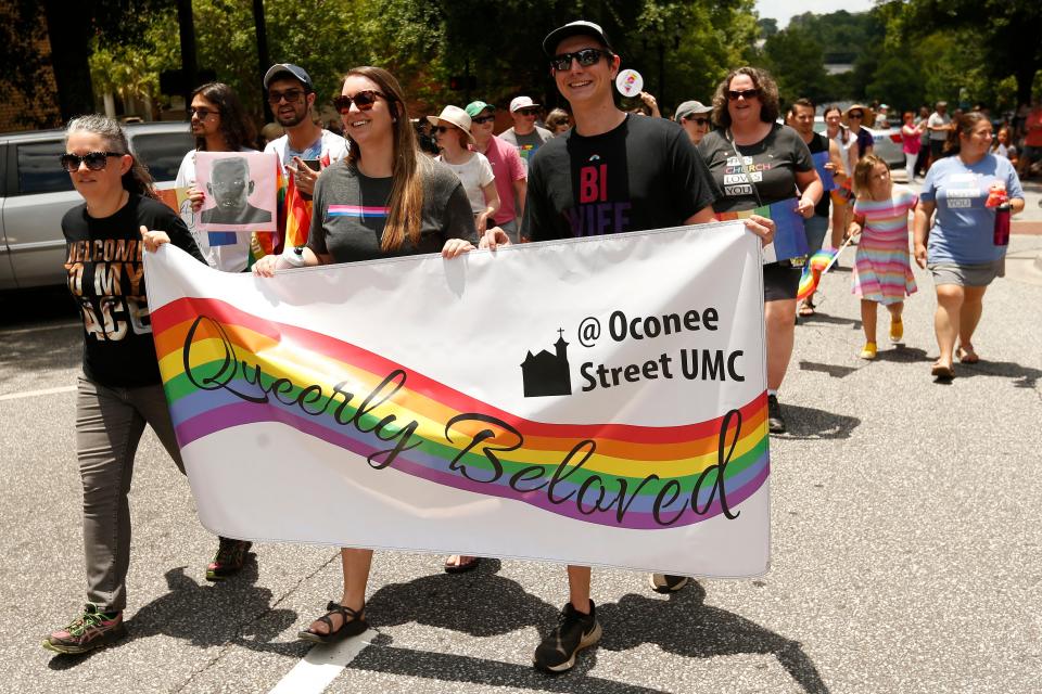 FILE - Oconee Street United Methodist Church took part in the inaugural Athens Pride Parade in downtown Athens, Ga., on Sunday, June 12, 2022. Athens Pride was organized by the Athens Pride and Queer Collective.