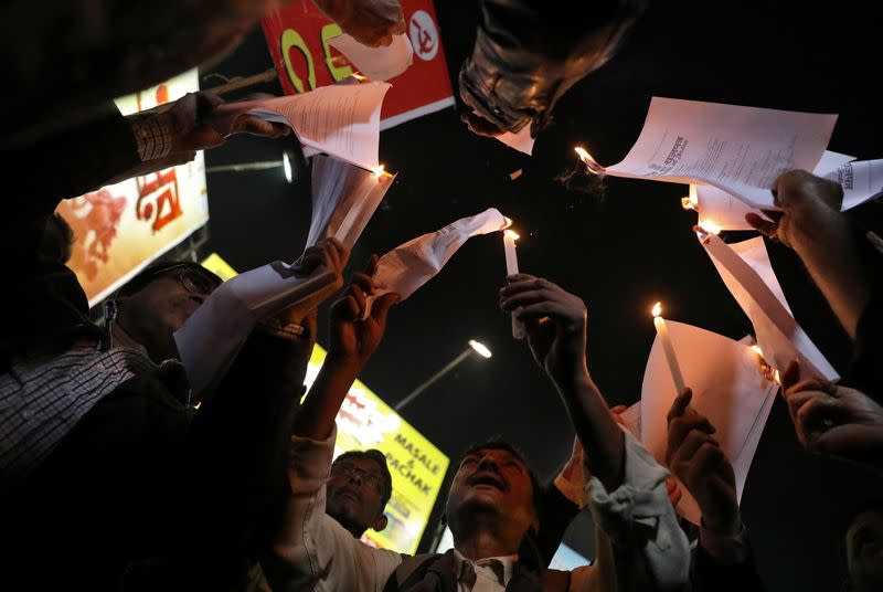 Demonstrators burn copies of Citizenship Amendment Act during a protest in Kolkata