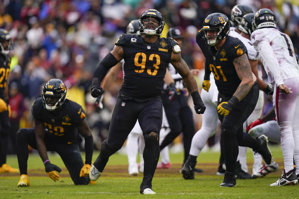 Washington Commanders defensive tackle Jonathan Allen (93) reacting after tacking Atlanta Falcons running back Cordarrelle Patterson (84) and stopping a point conversion during the first half of an NFL football game, Sunday, Nov. 27, 2022, in Landover, Md. (AP Photo/Patrick Semansky)