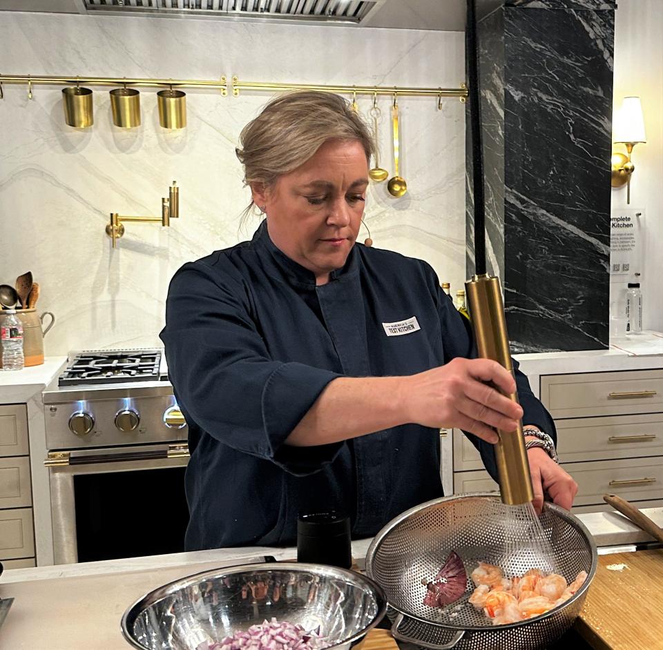 Julia Collin Davison, co-host of "America's Test Kitchen" television cooking show demonstrated Kohler's Purist Suspend, a ceiling mounted kitchen faucet.