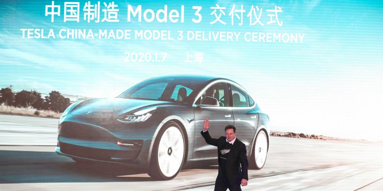Tesla CEO Elon Musk gestures during the Tesla China-made Model 3 Delivery Ceremony in Shanghai on January 7, 2020 i