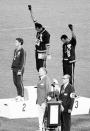 <p>American sprinters Tommie Smith and John Carlos finished first and third, respectively, in the 200-meter dash. On the podium, they defiantly raised their fists in solidarity of the Black Freedom Movement in the United States. This moment would be considered one of the most overt <a rel="nofollow noopener" href="http://time.com/3880999/black-power-salute-tommie-smith-and-john-carlos-at-the-1968-olympics/" target="_blank" data-ylk="slk:political statements;elm:context_link;itc:0;sec:content-canvas" class="link ">political statements</a> made at the Games.</p>