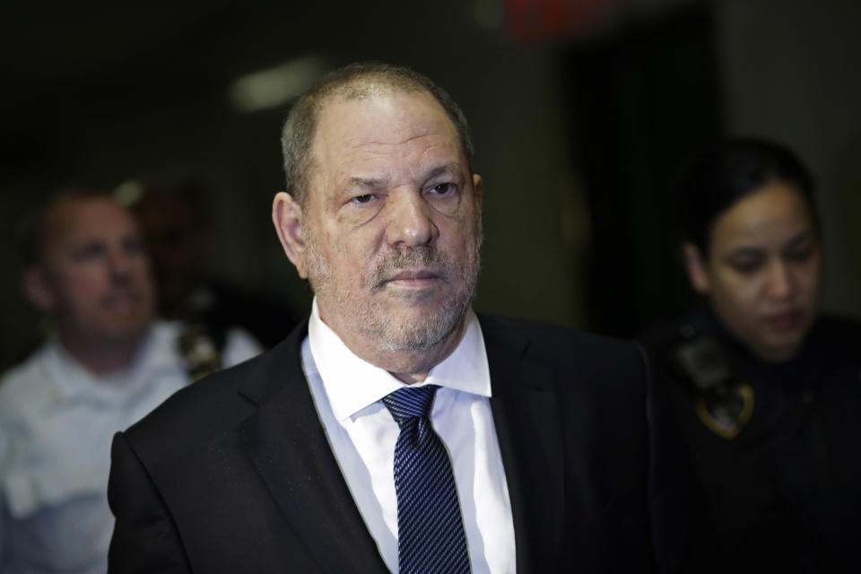 FILE - In this Oct. 11, 2018 file photo, Harvey Weinstein enters State Supreme Court in New York. New York prosecutors say the former lead police detective in Weinstein's sexual assault investigation urged one of his accusers to delete information from her phone before turning it over to prosecutors. The Manhattan District Attorney’s office detailed the alleged misconduct in a letter to Weinstein’s lawyer that was made public Wednesday, Oct. 17. (AP Photo/Mark Lennihan, File)