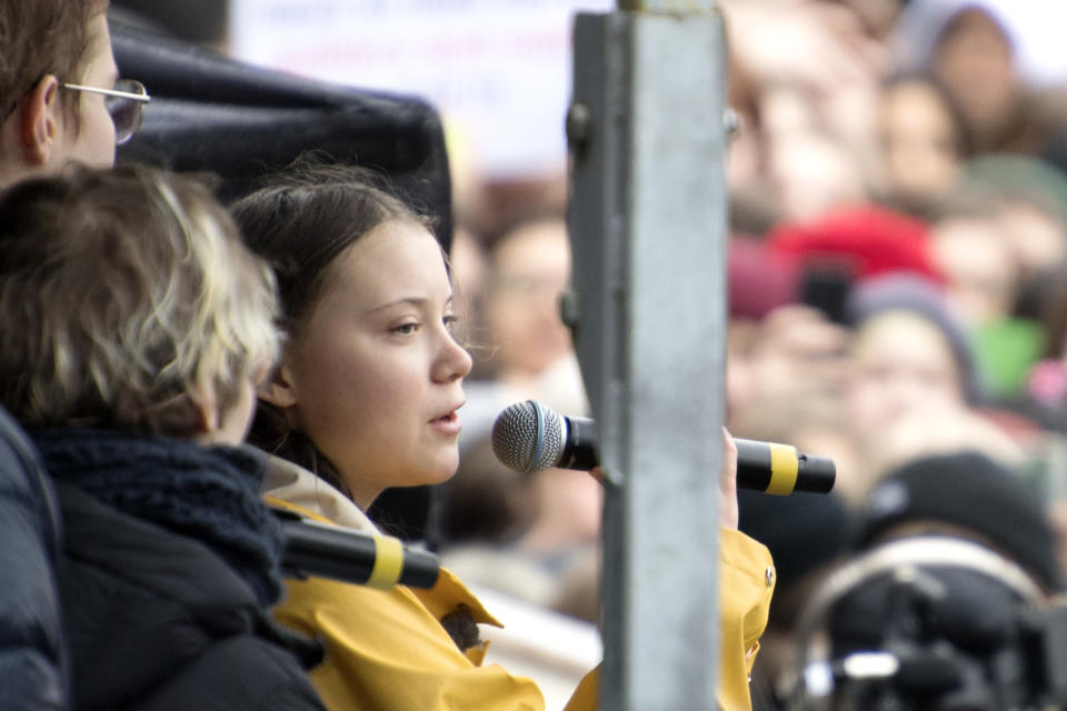 Swedish activist Greta Thunberg, right, speaks during a climate change demonstration, in central Stockholm, Sweden, Friday March 15, 2019. Friday's rallies by students around the world were one of the biggest international actions yet to demand more government action to fight climate change. The coordinated 'school strikes,' were inspired by 16-year-old Swedish activist Greta Thunberg, who began holding solitary demonstrations outside the Swedish parliament last year. (Henrik Montgomery/TT via AP)