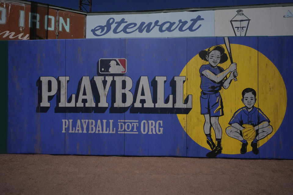 New MLB signs adorn the outfield walls at Rickwood Field, Monday, June 10, 2024, in Birmingham, Ala. Rickwood Field, known as one of the oldest professional ballpark in the United States and former home of the Birmingham Black Barons of the Negro Leagues, will be the site of a special regular season game between the St. Louis Cardinals and San Francisco Giants on June 20, 2024. (AP Photo/Brynn Anderson)