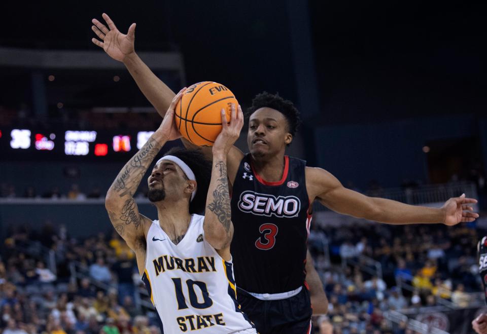 Murray State's Tevin Brown (10) shoots while defended by  Southeast Missouri's Eric Reed Jr. (3) during their semifinal game of the 2022 Ohio Valley Conference Men's Basketball Championship at Ford Center in Evansville, Ind., March 4, 2022.