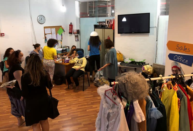 Members of the Cairo-based theatre group Sitara pack props and costumes to be put in storage, after the theatre was closed following the outbreak of the coronavirus disease (COVID-19), in Cairo