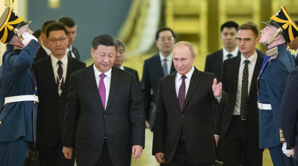 Russian President Vladimir Putin, center right, welcomes Chinese President Xi Jinping, center left, for the talks in the Kremlin in Moscow, Russia, Wednesday, June 5, 2019. Chinese President Xi Jinping is on visit to Russia this week and is expected to attend Russia's main economic conference in St. Petersburg. (AP Photo/Alexander Zemlianichenko, Pool)