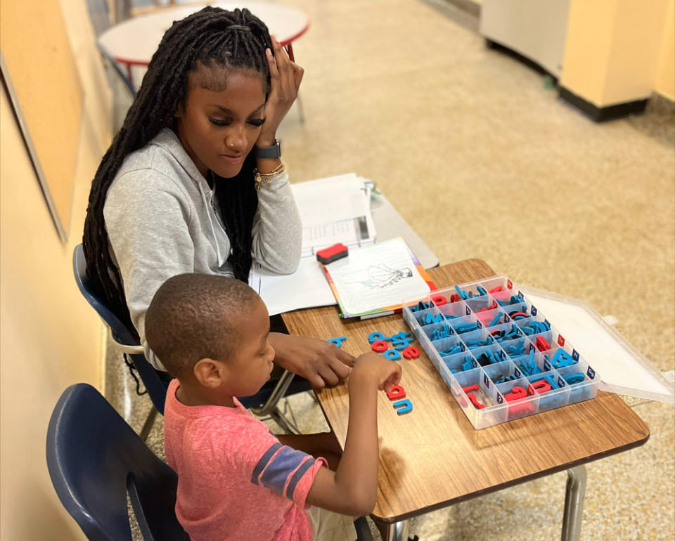 The elementary schoolers who work with American University tutors progress about 25% faster in reading than their classmates. (David Murray)