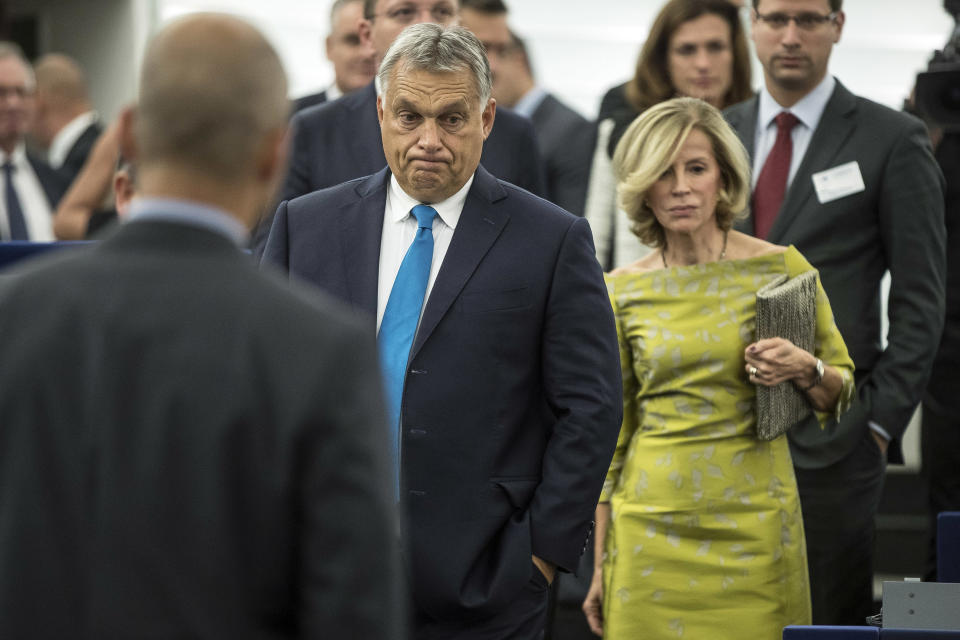 Hungary's Prime Minister Viktor Orban, center, arrives to deliver his speech at the European Parliament in Strasbourg, eastern France, Tuesday Sept.11, 2018. The European Parliament debates whether Hungary should face political sanctions for policies that opponents say are against the EU's democratic values and the rule of law. (AP Photo/Jean-Francois Badias)