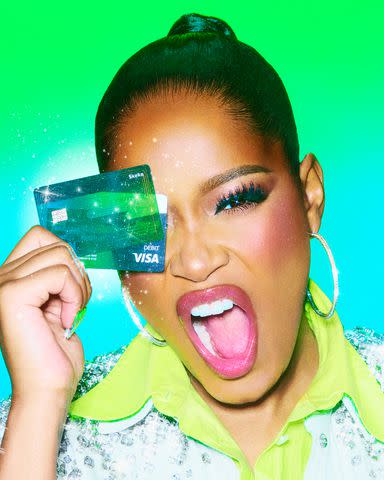 <p>Cash App</p> Keke Palmer poses with Cash App's new Glitter Cash App Card