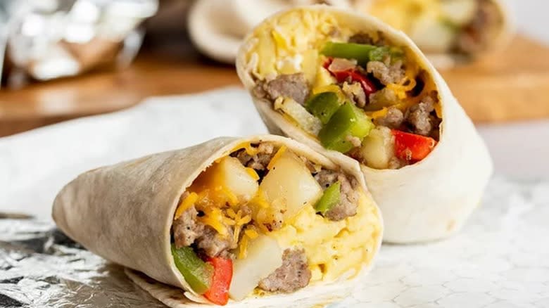 Close-up of two halves of a cut breakfast burrito