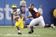 Denard Robinson #16 of the Michigan Wolverines runs the ball in the first quarter against the Luther Maddy #92 of the Virginia Tech Hokies during the Allstate Sugar Bowl at Mercedes-Benz Superdome on January 3, 2012 in New Orleans, Louisiana. (Photo by Matthew Stockman/Getty Images)