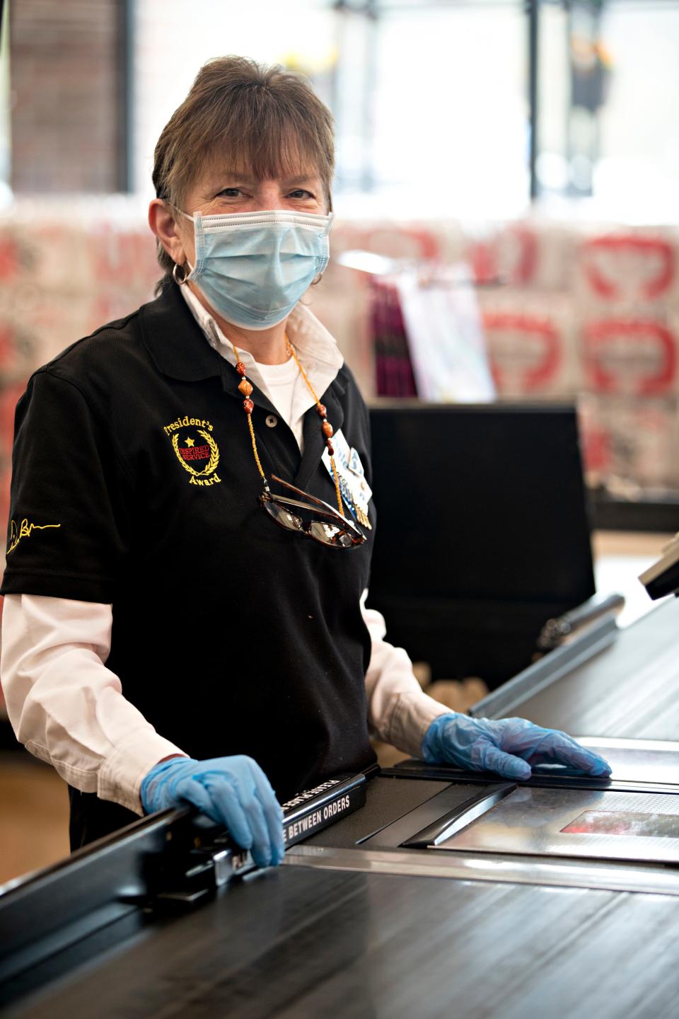 Dale Ann Wight, Kroger cashier, stands at her registrar  at Kroger on Tuesday, April 7, 2020, in Newport, Ky.  "I'm just here to do my job, I don't think I'm anything special but it's scary it's still scary," Dale Ann Wight said.

***for heroes project, please don't use unless this has published***