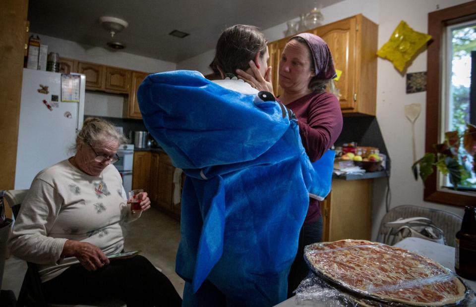 A woman comforts her daughter.