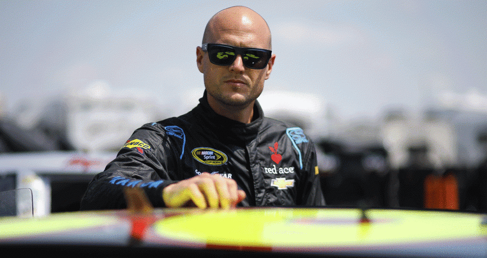 Josh Wise stands outside his Xfinity Series car at Michigan