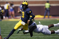 Michigan quarterback J.J. McCarthy rushes during the second half of an NCAA college football game against Colorado State, Saturday, Sept. 3, 2022, in Ann Arbor, Mich. (AP Photo/Carlos Osorio)