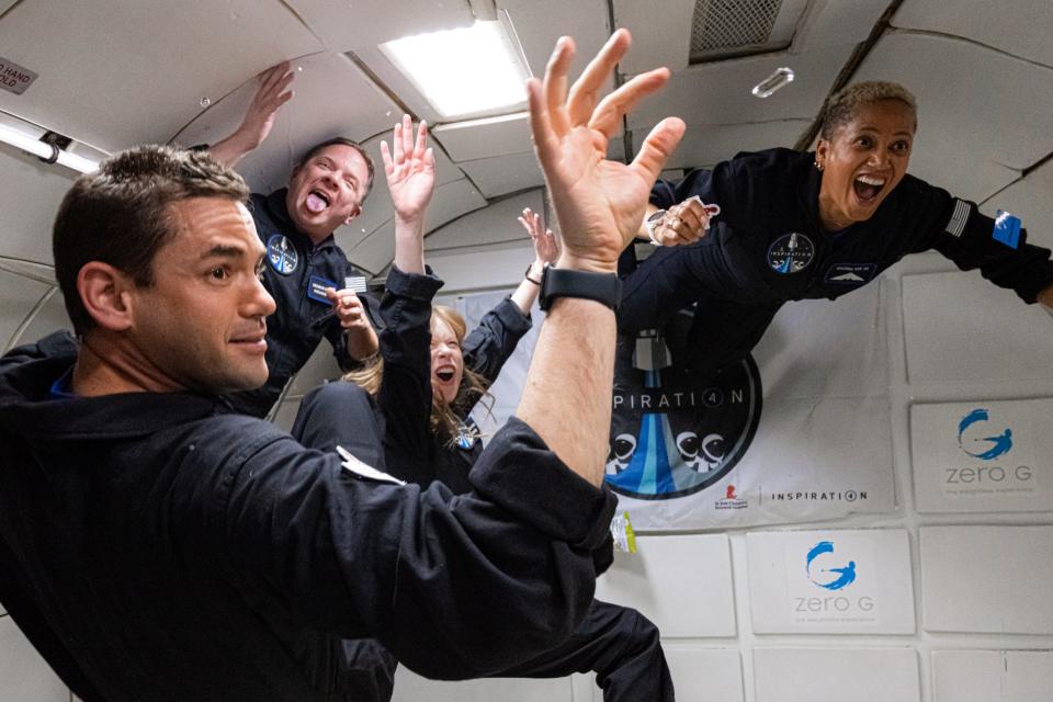 inspiration4 crew members screaming joy floating weightless inside plane