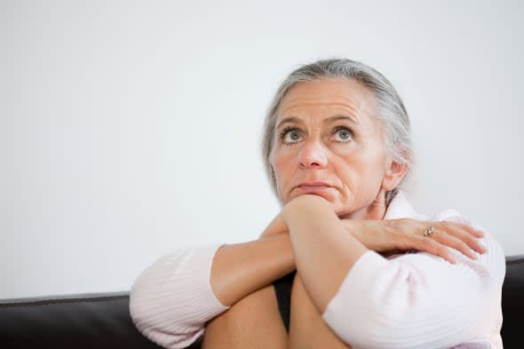 Mature woman looking anxious