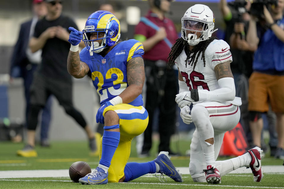 Los Angeles Rams running back Kyren Williams (23) signals after gaining yardage against Arizona Cardinals safety Andre Chachere (36) during the second half of an NFL football game Sunday, Oct. 15, 2023, in Inglewood, Calif. (AP Photo/Ashley Landis)