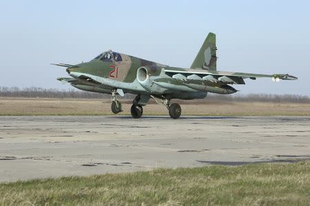 A Russian Sukhoi Su-25 fighter jet arriving from Syria lands at an airbase in Krasnodar region, southern Russia, in this March 16, 2016 handout photo by the Russian Ministry of Defence. REUTERS/Russian Ministry of Defence/Olga Balashova/Handout via Reuters