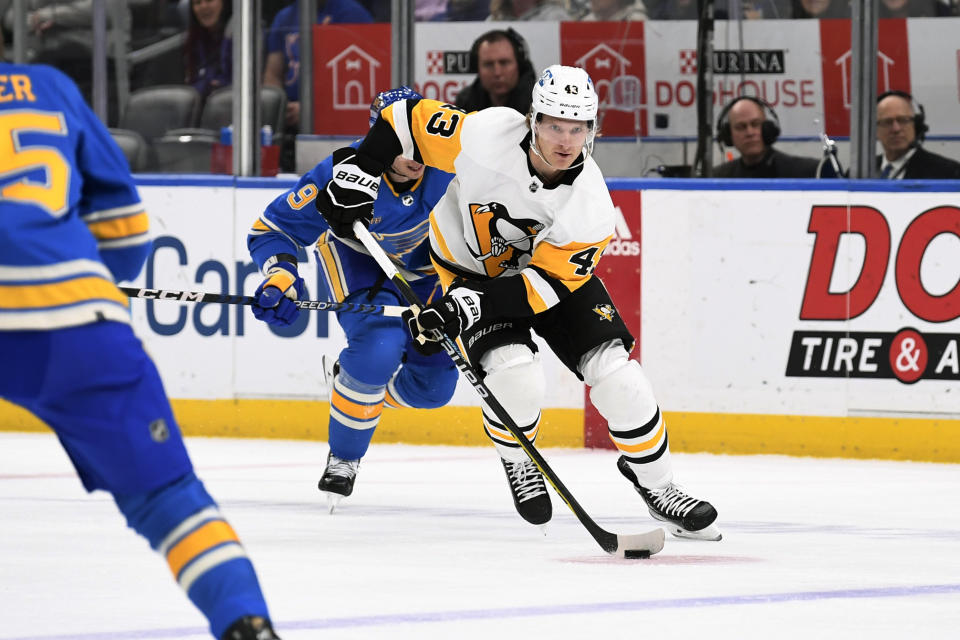 Pittsburgh Penguins left wing Danton Heinen (43) controls the puck form the St. Louis Blues during the first period of an NHL hockey game, Saturday, Feb. 25, 2023, in St. Louis. (AP Photo/Jeff Le)