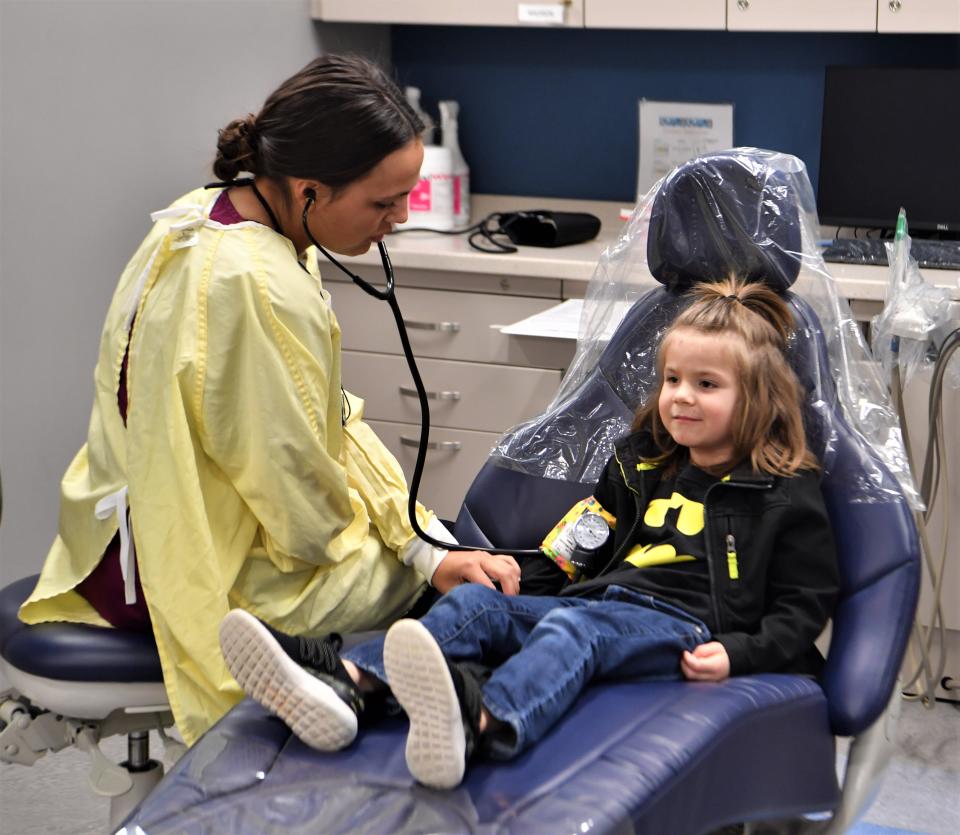 MSU Texas dental hygiene major Madison Tavarez takes a routine blood pressure test on her patient during MSU's "Give Kids A Smile Day," Monday, Feb. 20, 2023, at Centennial Hall.