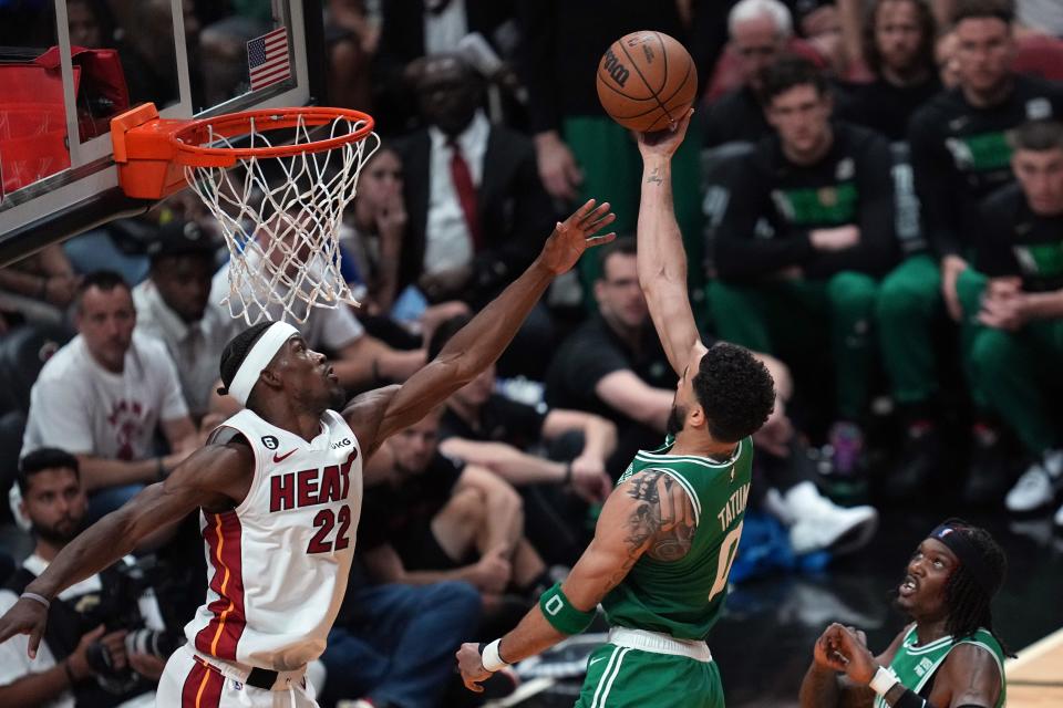 Boston Celtics forward Jayson Tatum (0) shoots against Miami Heat forward Jimmy Butler (22) in the third quarter during Tuesday's Game 4 of the Eastern Conference Finals at the Kaseya Center in Miami.