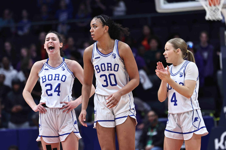 Springboro players Chloe Downing (24), Aniya Trent (30) and Brooke Clear react after their win over Pickerington Central in the OHSAA state tournament Friday, March 15, 2024.