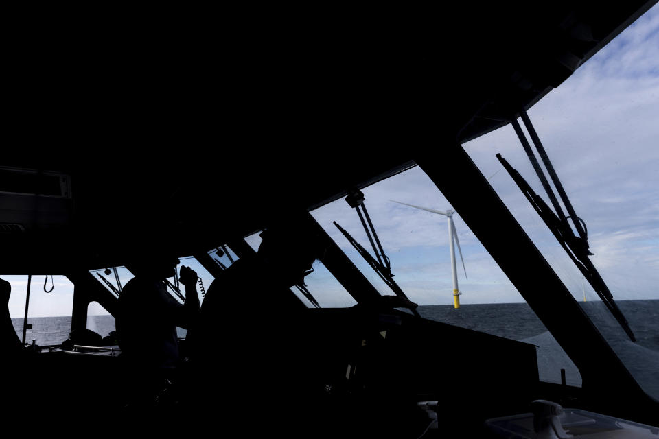 The first operating South Fork Wind farm turbine, Thursday, Dec. 7, 2023, 35 miles east of Montauk Point, N.Y., on the Atlantic Ocean. The turbine at the commercial-scale offshore wind farm is producing power for the U.S. electric grid for the first time. (AP Photo/Julia Nikhinson)