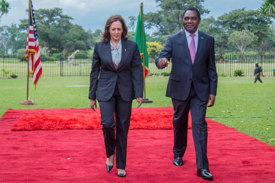 Vice President Kamala Harris and Zambian President Hakainde Hichilema walk outside the State House in the Zambian capital, Lusaka, on March 31, 2023. <a href="https://www.gettyimages.com/detail/news-photo/vice-president-kamala-harris-and-zambian-president-hakainde-news-photo/1250104734?adppopup=true" rel="nofollow noopener" target="_blank" data-ylk="slk:Salim Dawood/AFP via Getty Images;elm:context_link;itc:0;sec:content-canvas" class="link ">Salim Dawood/AFP via Getty Images</a>