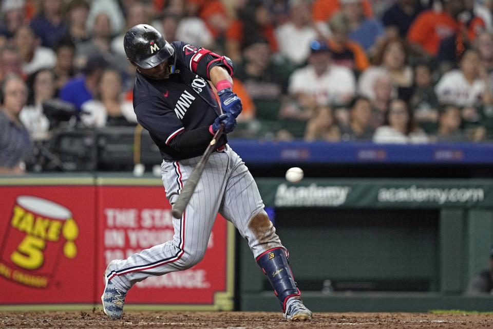 Minnesota Twins' Donovan Solano hits a two-run double against the Houston Astros during the sixth inning of a baseball game Wednesday, May 31, 2023, in Houston. (AP Photo/David J. Phillip)