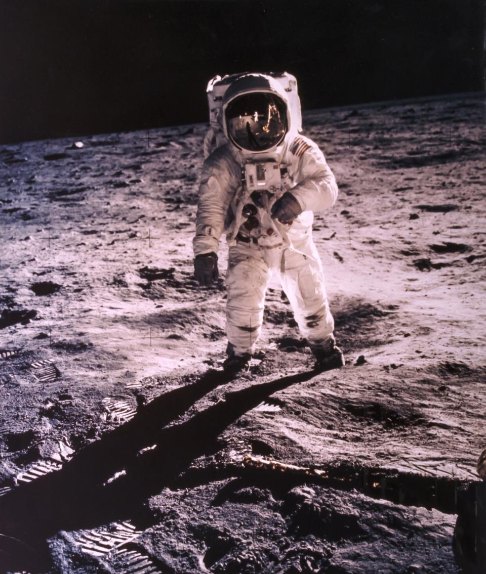 Neil Armstrong portrait of Buzz Aldrin with the photographer and the Apollo 11 Lunar Module reflected in his gold-plated visor.