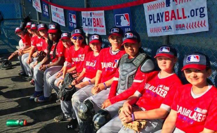 The girls of the Trailblazer Series sitting in the dugout. (Twitter/@baseballfor_all)