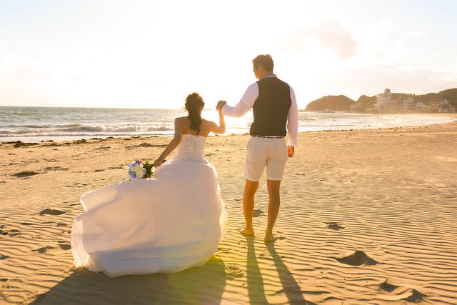 <p>Getty</p> Stock image of a beach wedding