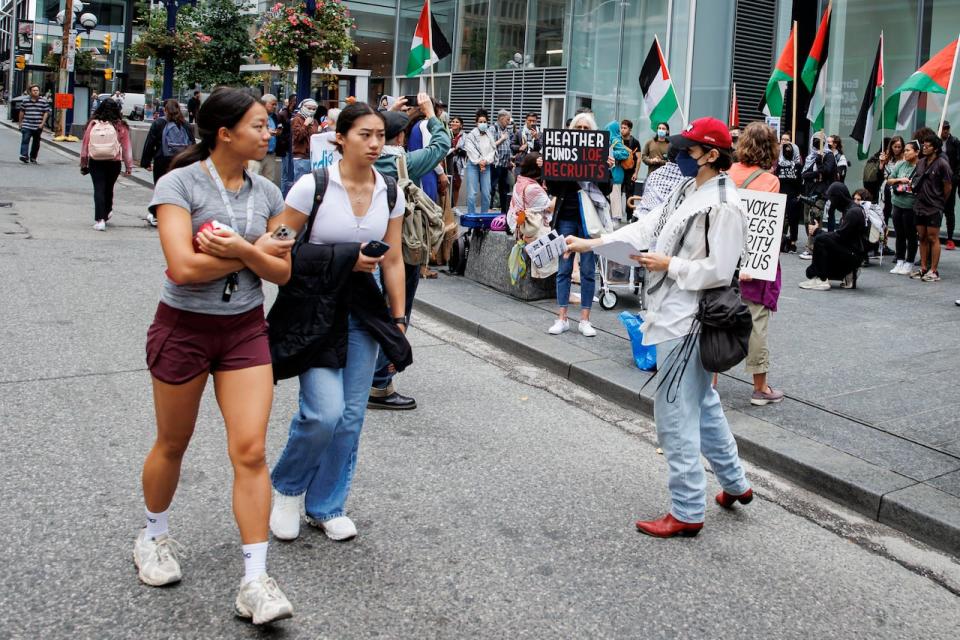 Activists hold a rally outside a Toronto Indigo bookstore as part of a Canada-wide boycott campaign on Sept. 25, 2024.