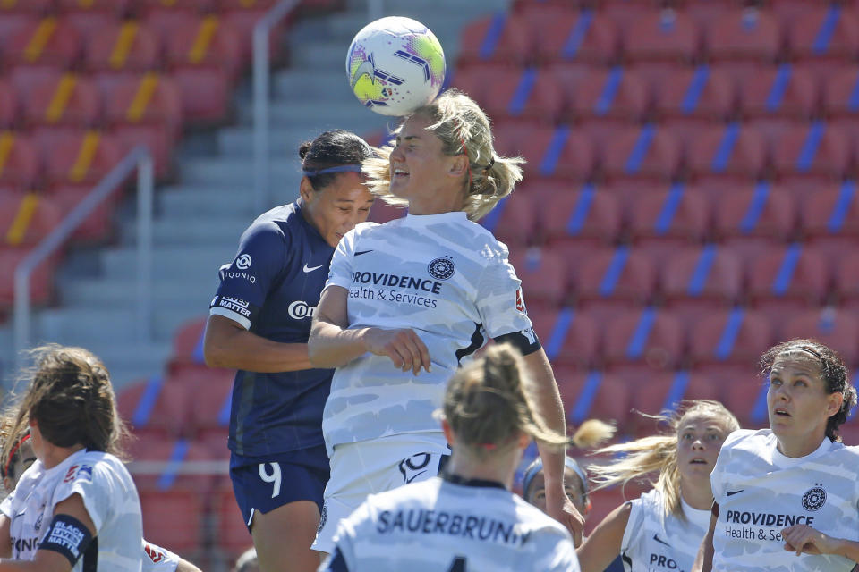 North Carolina Courage forward Lynn Williams (9) and Portland Thorns FC midfielder Lindsey Horan (10) battle for the ball during the first half of an NWSL Challenge Cup soccer match at Zions Bank Stadium, Saturday, June 27, 2020, in Herriman, Utah. (AP Photo/Rick Bowmer)