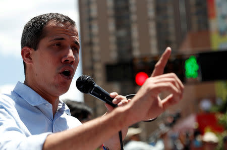 Venezuelan opposition leader Juan Guaido, who many nations have recognized as the country's rightful interim ruler, attends a rally against Venezuelan President Nicolas Maduro's government in Caracas, Venezuela, April 6, 2019. REUTERS/Carlos Garcia Rawlins