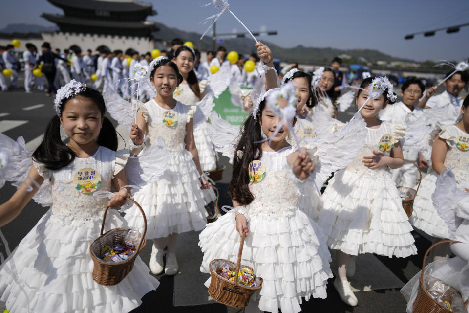 FILE - Children dressed as angels march during an Easter parade in Seoul, South Korea, on April 9, 2023. A new law that went into effect Wednesday, June 28, formalizes the international age-counting method as standard in administrative and civil laws and encourages people to tally their own ages accordingly. The country's previous age-counting method made people a year or two older than they really are. (AP Photo/Lee Jin-man, File)