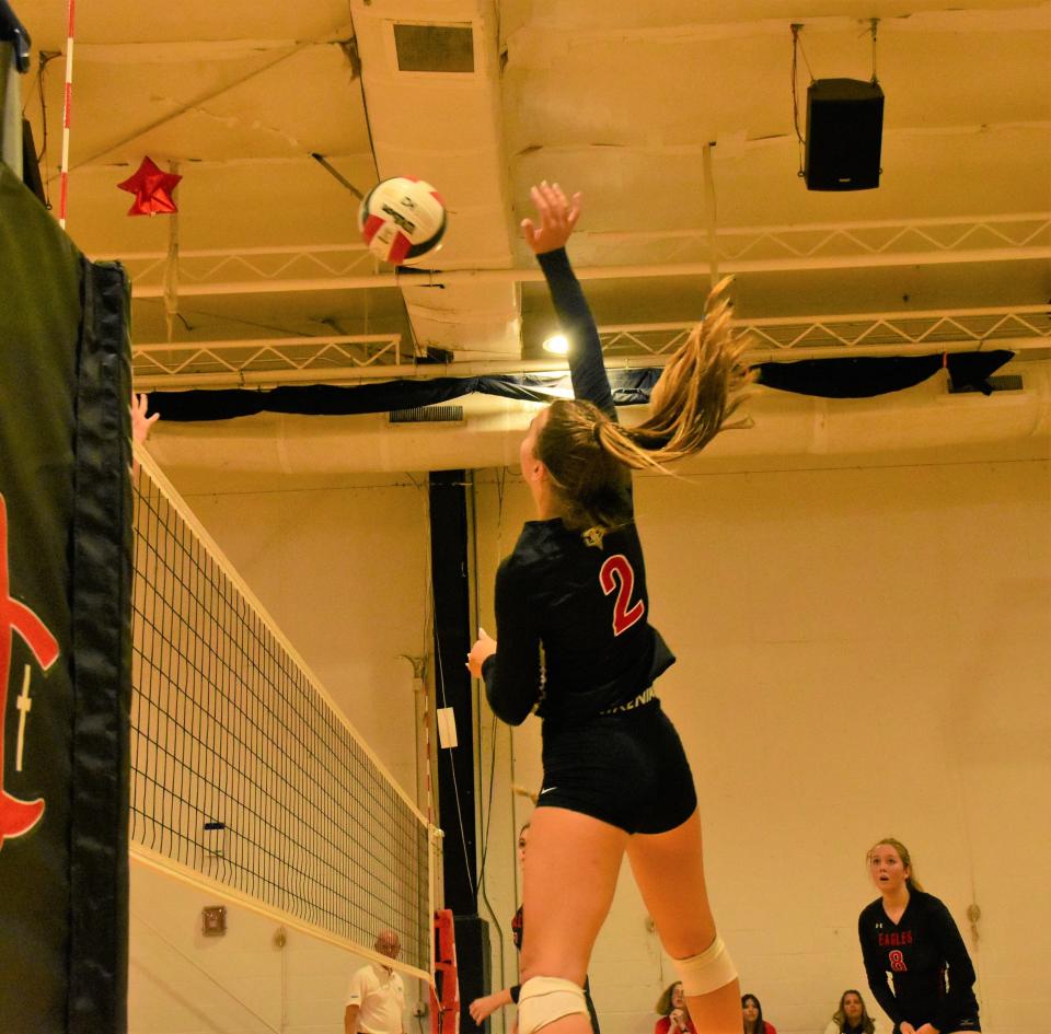 Jupiter Christian's Allison Moore attempts to slam the ball across the net in the third set of Thursday's five-set loss to Benjamin on Sept. 8, 2022.