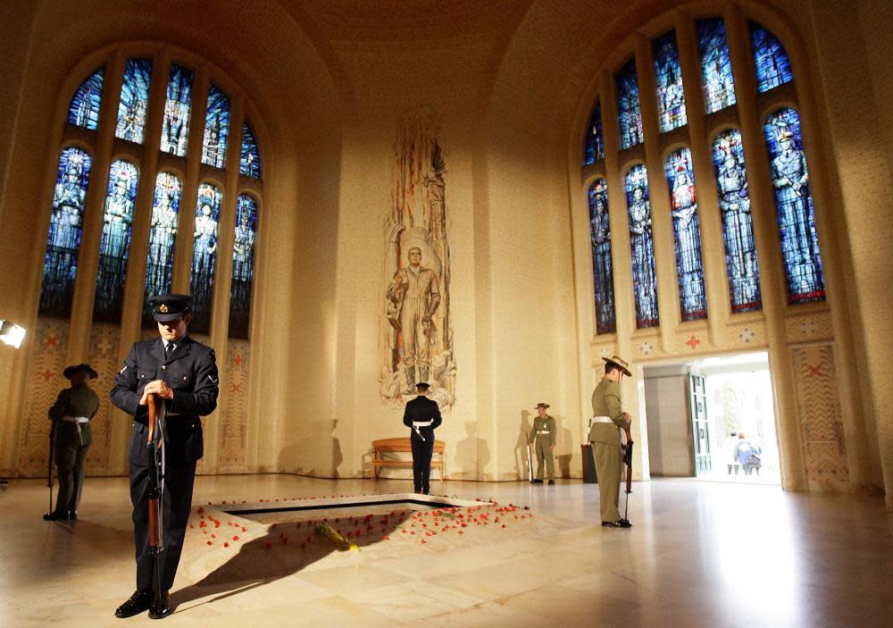 Servicemen stand guard around the tomb of the unknown soldier in Canberra on Anzac Day in 2009.