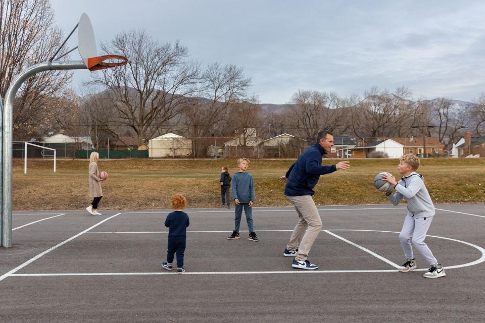 Rep. Blake Moore, R-Utah, plays with his children during a photoshoot at Dilworth Elementary School in Salt Lake City on Friday, Dec. 22, 2023. | Megan Nielsen, Deseret News