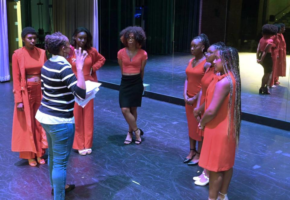 A volunteer and stage director for the Miss Juneteenth Pageant & Scholarship Program Atiya Canley goes over stage entrance directions with six contestants during their Sunday rehearsal at Silas High School in Tacoma. The pageant will be held on June 19 at Stewart Heights Park in Tacoma.