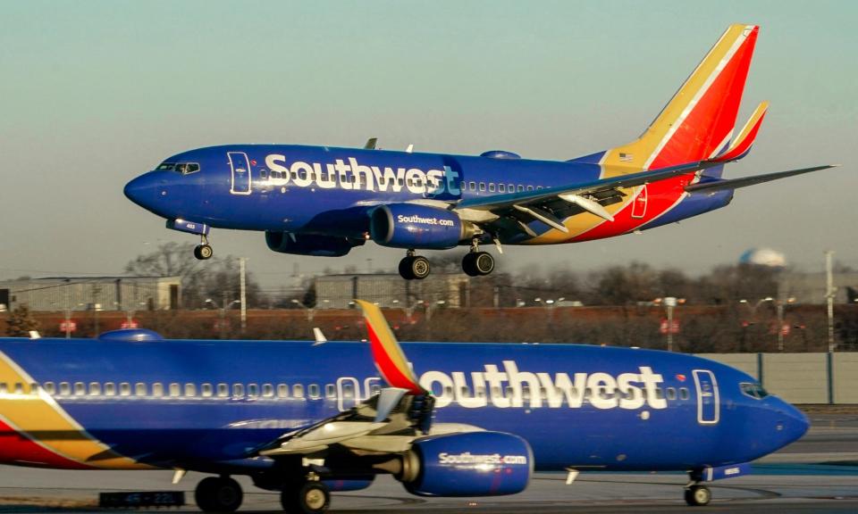 <span>Southwest Airlines plane prepares to land at Midway international airport, in Chicago. </span><span>Photograph: Kiichiro Sato/AP</span>