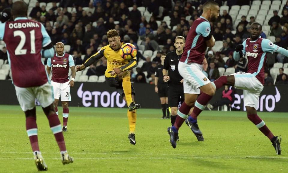Alex Oxlade-Chamberlain, centre, scores during Arsenal’s rout of West Ham.