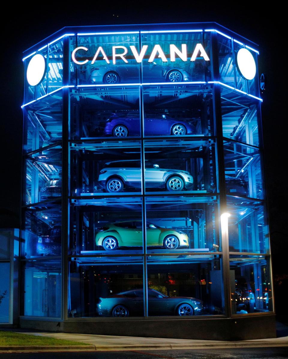 Vehicles are displayed at a Carvana dealership, which allows customers to buy a used car online and have it delivered or pick it up from an automated-tower, in Austin, Texas.