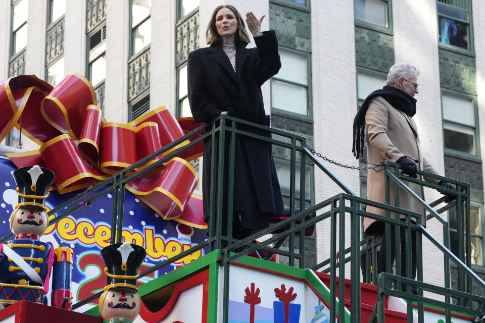 Katharine McPhee and David Foster ride the Hallmark Channel float in the Macy's Thanksgiving Day Parade on Thursday, Nov. 23, 2023, in New York. (Photo by Charles Sykes/Invision/AP)